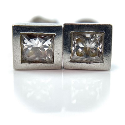 Lot 144 - A pair of platinum diamond stud earrings, each...