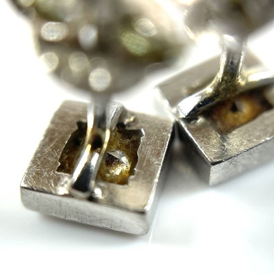 Lot 144 - A pair of platinum diamond stud earrings, each...