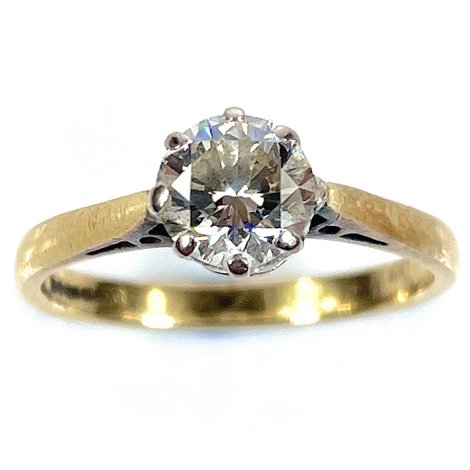 Lot 4 - An 18ct gold diamond solitaire ring, the round...