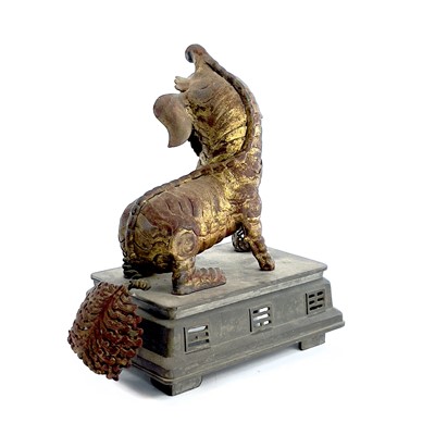 Lot 52 - A Chinese gilt metal model of a dog of fo,...