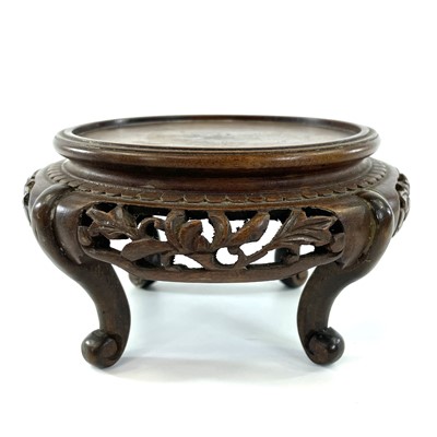 Lot 122 - A Chinese carved hardwood vase stand, early...