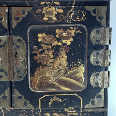 Lot 205 - A Japanese black lacquer table cabinet, late...