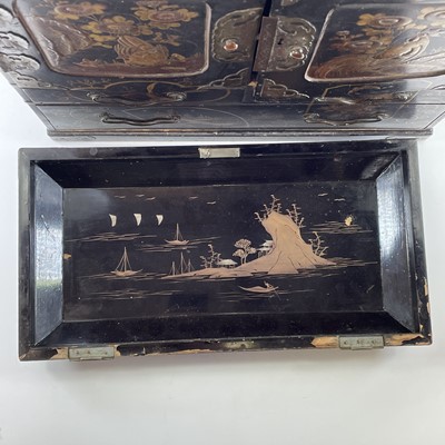 Lot 205 - A Japanese black lacquer table cabinet, late...