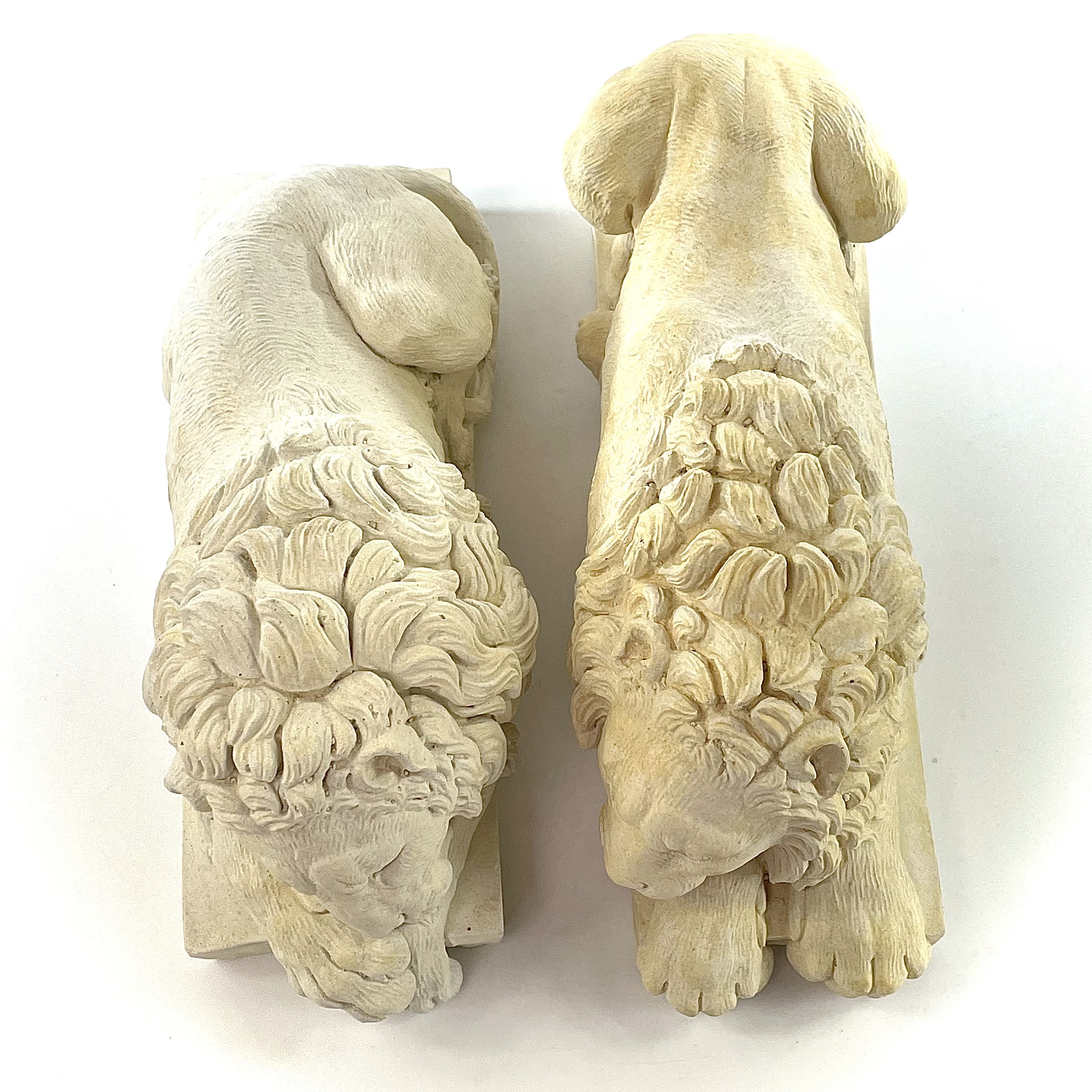 Lot 140 A pair of plaster Chatsworth sleeping lions