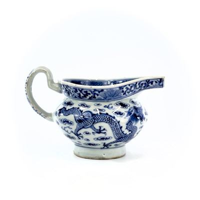 Lot 112 - A Chinese blue and white porcelain sauce boat,...