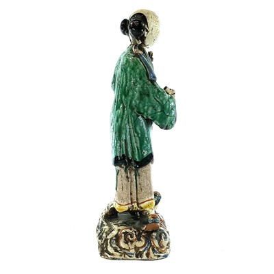 Lot 69 - A Chinese sancai-glazed standing figure,...