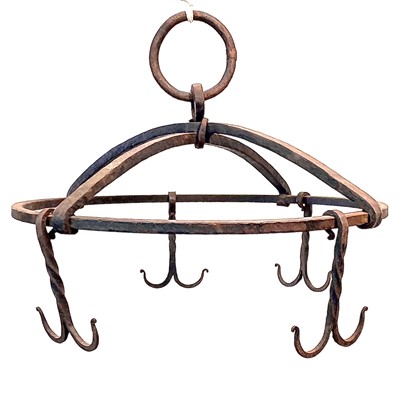 Lot 169 - A black painted circular wrought iron hanging rack, early 20th century.