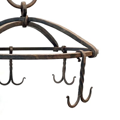 Lot 169 - A black painted circular wrought iron hanging rack, early 20th century.