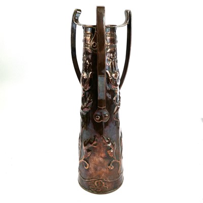Lot 65 - An Art Nouveau copper three handle vase with...