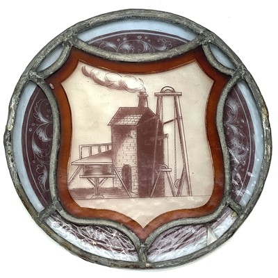 Lot 415 - A late 19th century circular stained glass...