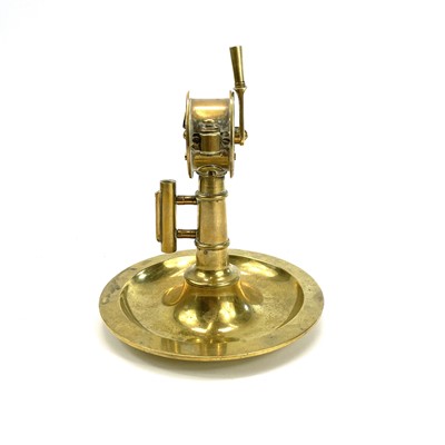 Lot 190 - A 20th century brass cigar cutter in the form...