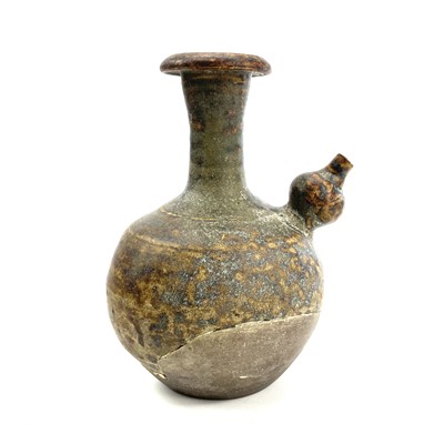 Lot 860 - A mottled tea dust glaze pottery kendi,...