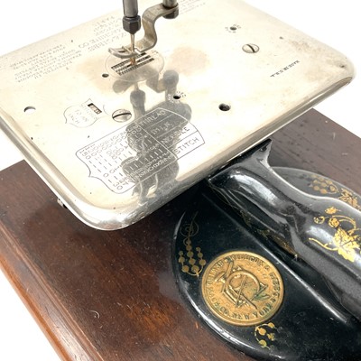 Lot 7 - A Willcox and Gibbs 'Silent' sewing machine,...