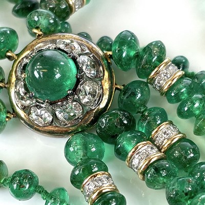 Lot 101 - Tambetti - A gold mounted emerald and diamond...