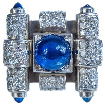 Lot 218 - An eccentric mid-century geometric design platinum, diamond and blue sapphire ring.