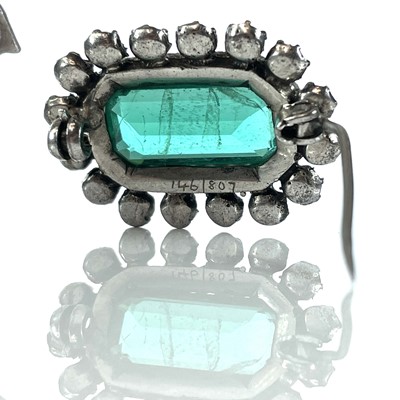 Lot 384 - Three white metal paste set brooches.