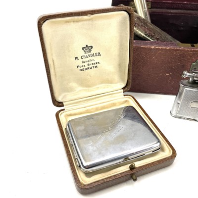 Lot 105 - A cigarette case with attached lighter...