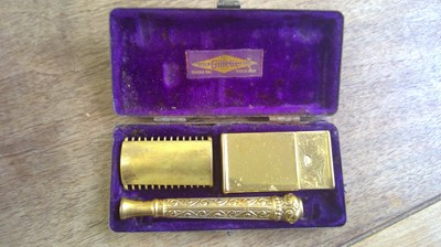 Lot 105 - A cigarette case with attached lighter...