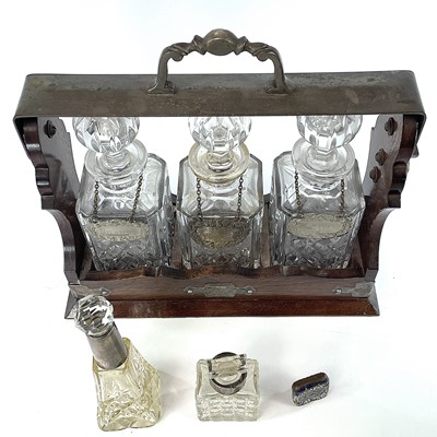 Lot 147 - An Edwardian oak and silver plated three...