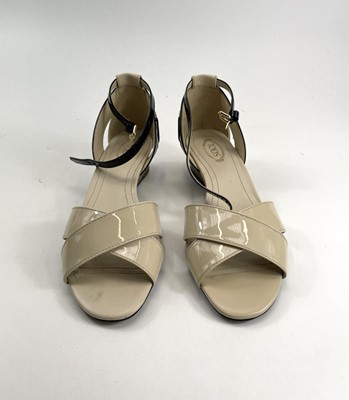 Lot 292 - A pair of Tod's black and cream patent leather...