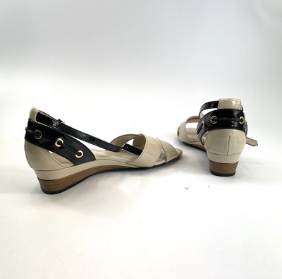 Lot 292 - A pair of Tod's black and cream patent leather...