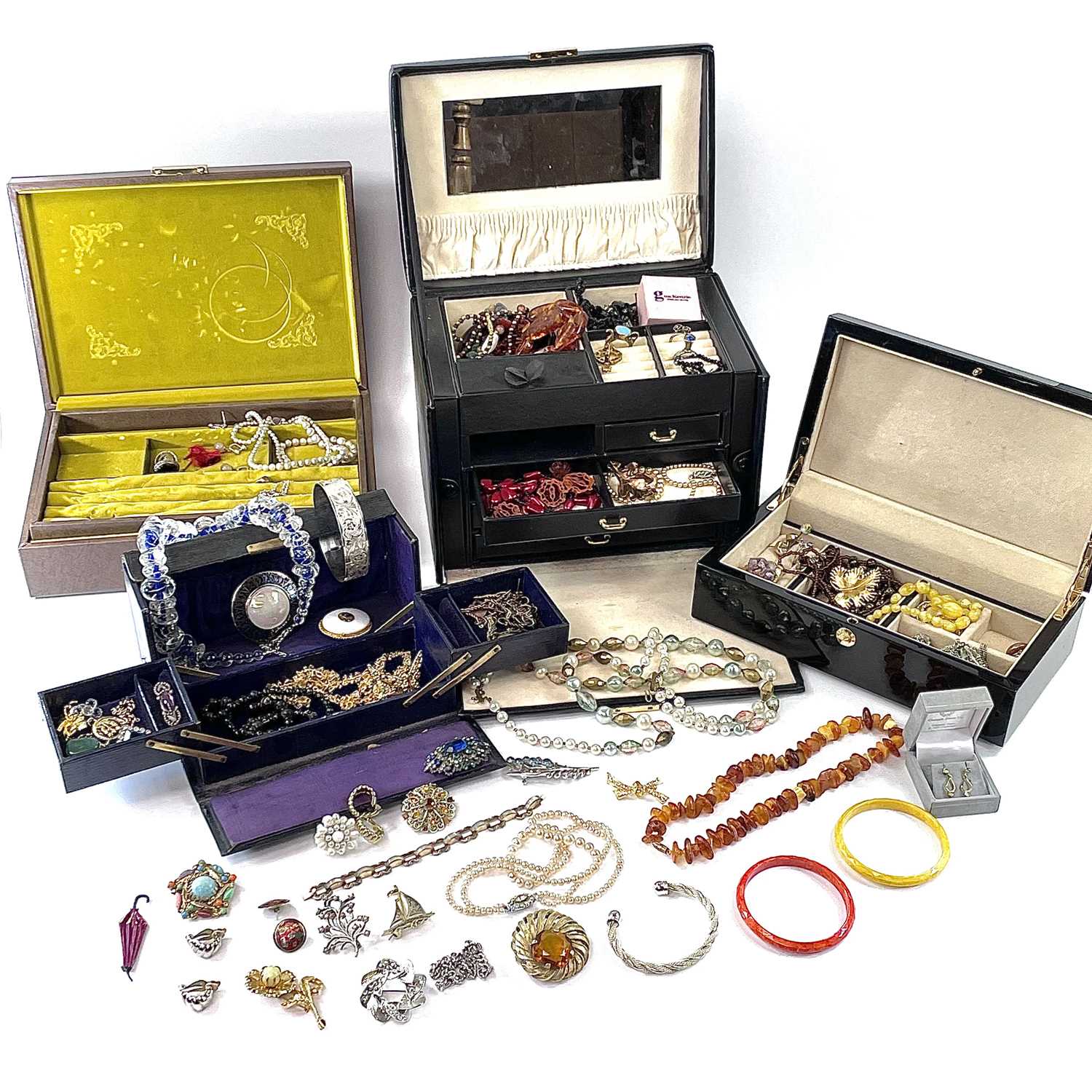 Lot 273 Four boxes of costume jewellery.