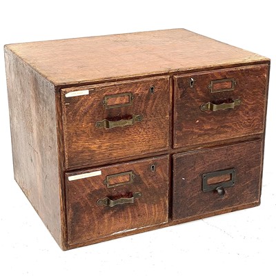 Lot 1874 - An oak four drawer office stationery cabinet,...