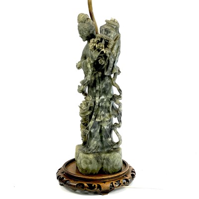 Lot 163 - A pair of Chinese green hardstone figures of...