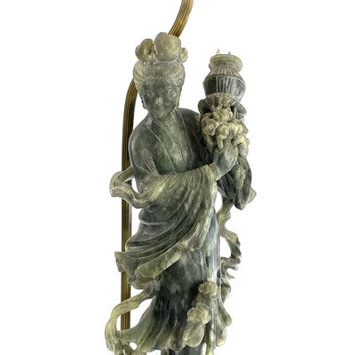 Lot 163 - A pair of Chinese green hardstone figures of...