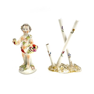 Lot 819 - An English porcelain figure of a cherub, early...