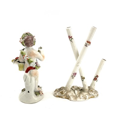 Lot 819 - An English porcelain figure of a cherub, early...