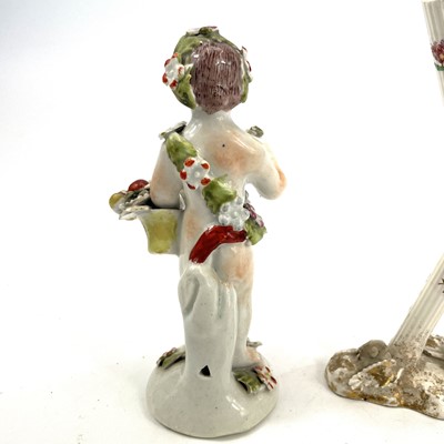 Lot 819 - An English porcelain figure of a cherub, early...