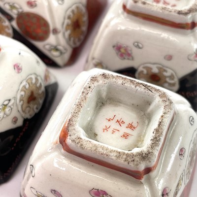 Lot 79 - A set of four Japanese porcelain saki cups,...