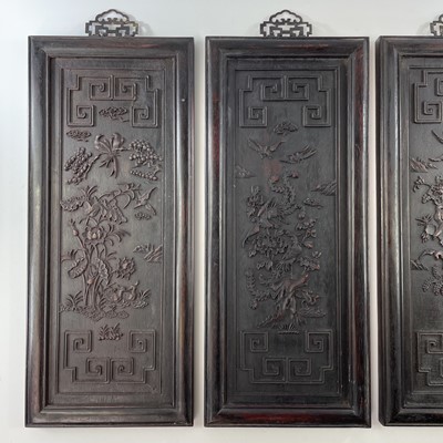 Lot 175 - A set of four Chinese rectangular carved wood...