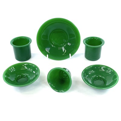 Lot 210 - Two Peking green glass cups and saucers, one...