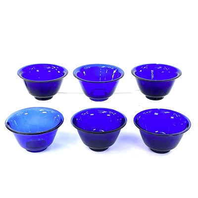 Lot 211 - Six Peking blue glass bowls, largest height...