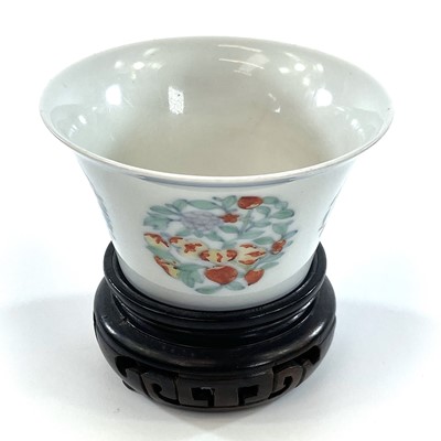 Lot 216 - A Chinese doucai porcelain cup, Qing Dynasty,...