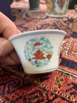 Lot 216 - A Chinese doucai porcelain cup, Qing Dynasty,...