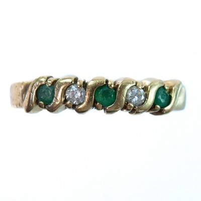 Lot 96 - A modern 9ct hallmarked gold emerald and diamond five stone ring.