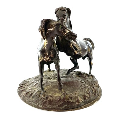 Lot 98 - A French gilt metal figure group of two horses,...