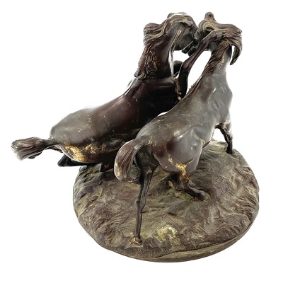 Lot 98 - A French gilt metal figure group of two horses,...