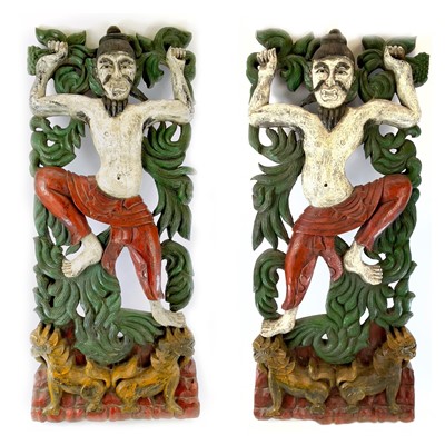 Lot 254 - A pair of Chinese painted carved wood panels,...