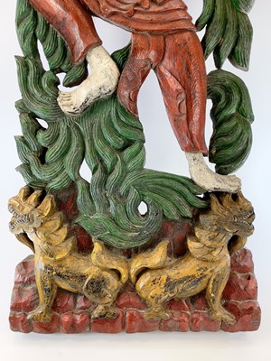 Lot 254 - A pair of Chinese painted carved wood panels,...