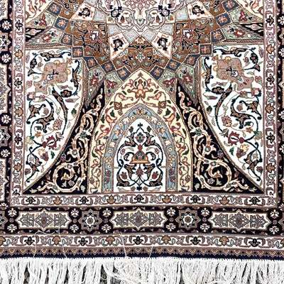 Lot 1247 - A Persian rug, the indigo field with a large...