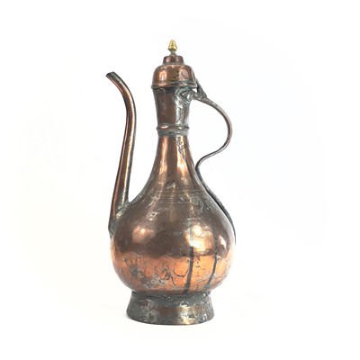 Lot 1021 - An Islamic tinned copper ewer, 19th century,...