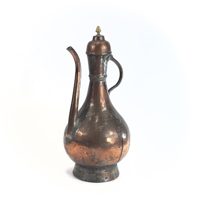Lot 1021 - An Islamic tinned copper ewer, 19th century,...