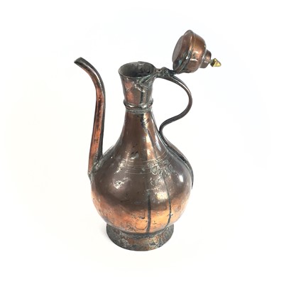 Lot 1021 - An Islamic tinned copper ewer, 19th century,...