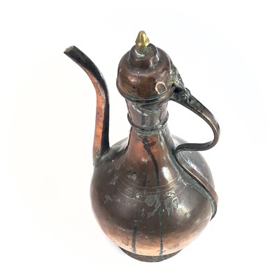 Lot 1021 - An Islamic tinned copper ewer, 19th century,...