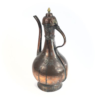 Lot 1021 - An Islamic tinned copper ewer, 19th century,...