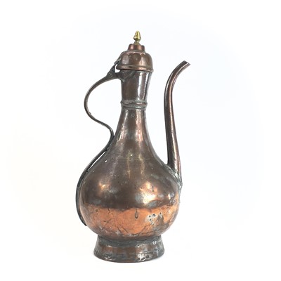 Lot 1021 - An Islamic tinned copper ewer, 19th century,...